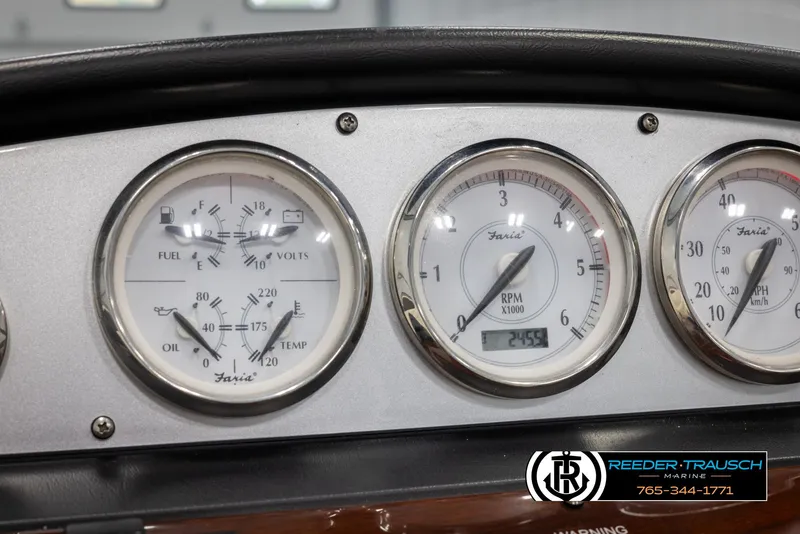 Slide: The Image of Dashboard gauges of a 2008 Regal 1900 boat, showing fuel, RPM, and temperature. - 31