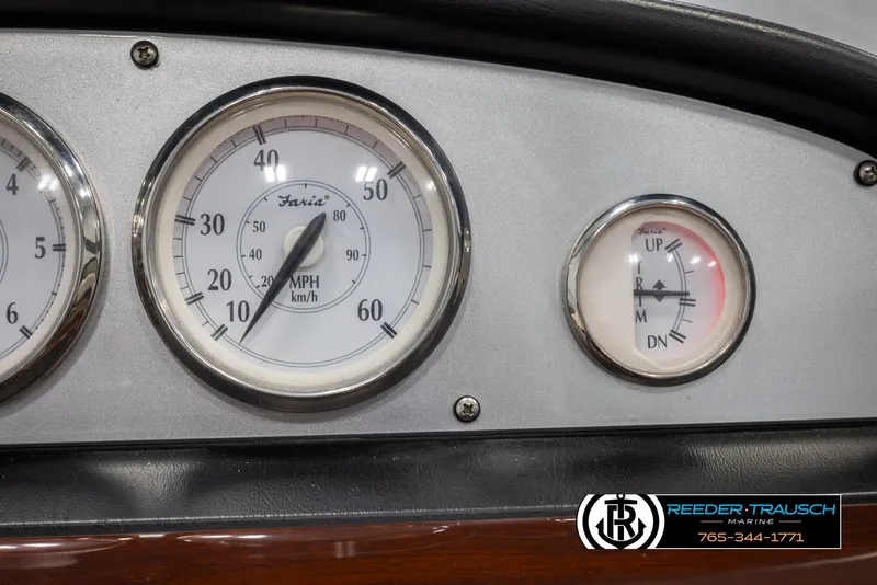 Slide: The Image of Dashboard gauges of a 2008 Regal 1900 boat, featuring speedometer and trim indicator. - 32