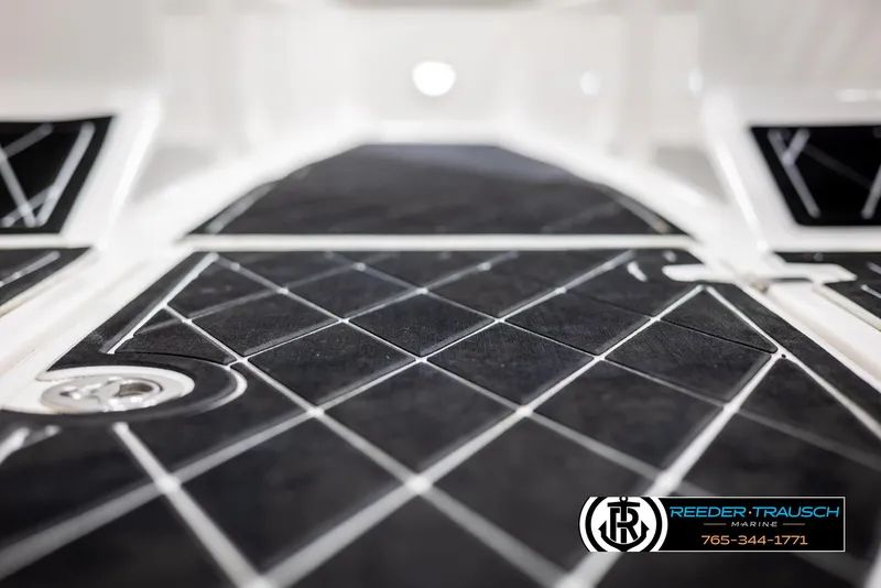 Slide: The Image of Close-up of 2008 Regal 1900 boat interior with black diamond-patterned flooring. - 34