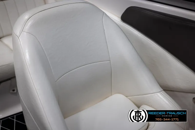 Slide: The Image of White leather seat in a 2008 Regal 1900 boat interior. - 39