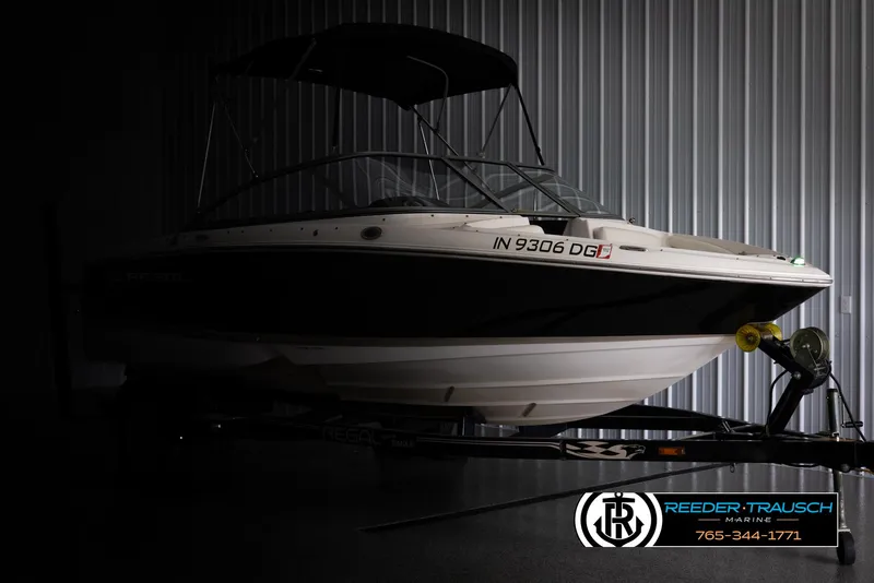 Slide: The Image of 2008 Regal 1900 boat in storage, side view, with trailer and cover. - 4