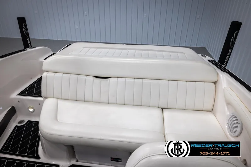 Slide: The Image of 2008 Regal 1900 boat interior with white seating and logo. - 42