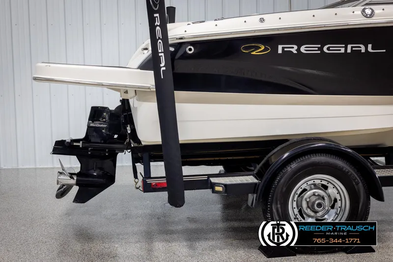 Slide: The Image of 2008 Regal 1900 boat on trailer, side view, in showroom. - 46