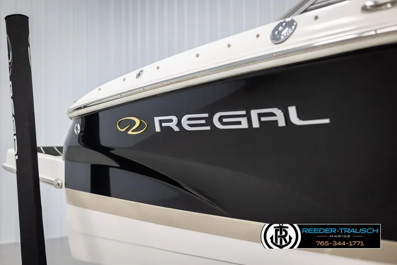 Slide: The Image of 2008 Regal 1900 boat, black and white exterior, close-up view. - 49