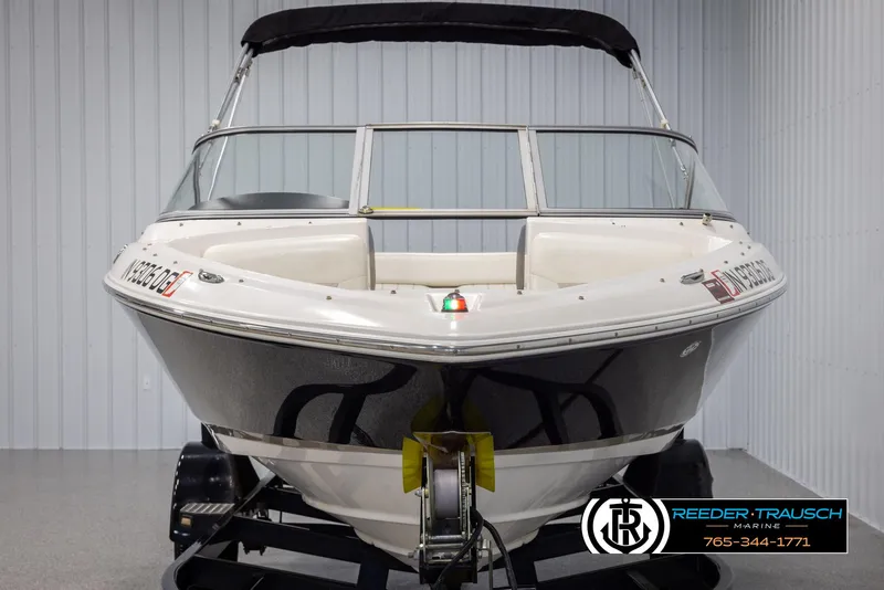 Slide: The Image of 2008 Regal 1900 boat on trailer in indoor storage facility. - 9