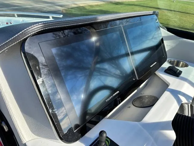 Slide: The Image of 2025 Regal LS9 Surf boat dashboard with touchscreen display and controls. - 10