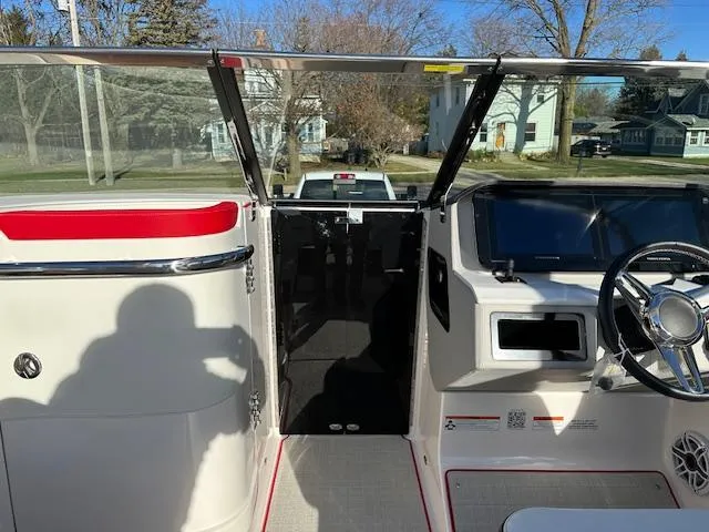 Slide: The Image of 2025 Regal LS9 Surf boat interior with steering wheel and dashboard. - 17