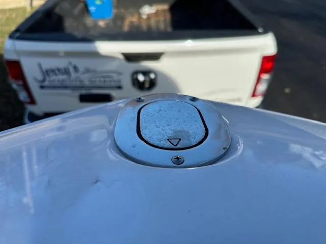 Slide: The Image of 2025 Regal LS9 Surf boat detail with a truck in the background. - 20