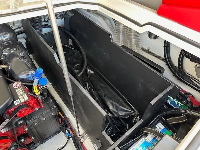 Slide: The Image of Engine compartment of 2025 Regal LS9 Surf boat, showcasing mechanical components and wiring. - 26