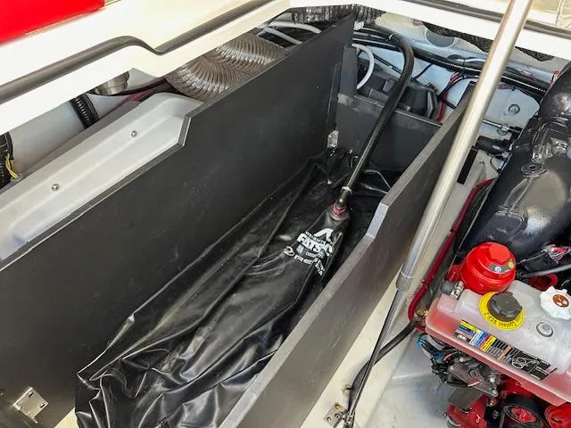 Slide: The Image of 2025 Regal LS9 Surf boat engine compartment with visible components and wiring. - 27