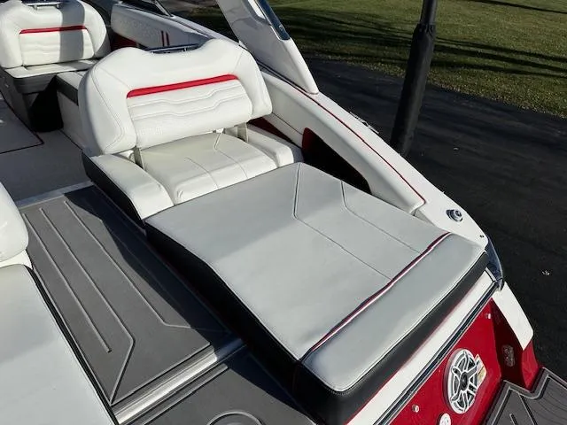 Slide: The Image of 2025 Regal LS9 Surf boat interior with white and red seating. - 30