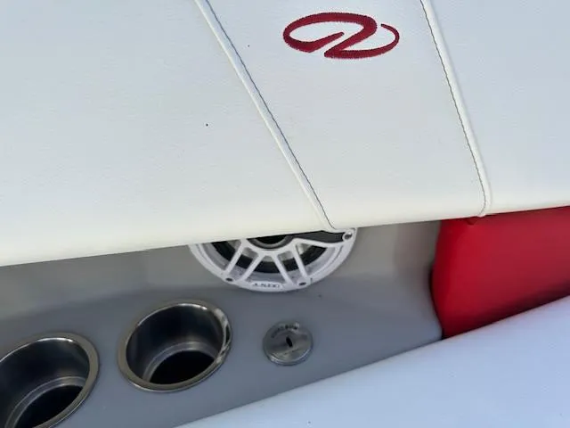 Slide: The Image of 2025 Regal LS9 Surf boat interior with speaker and cup holders. - 33