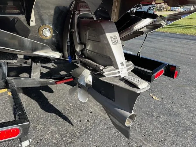 Slide: The Image of 2025 Regal LS9 Surf boat propeller and stern on a trailer. - 37
