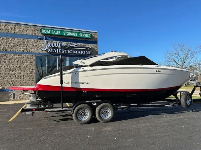 Slide: The Image of 2025 Regal LS9 Surf boat on trailer at Jerry's Majestic Marine dealership. - 46
