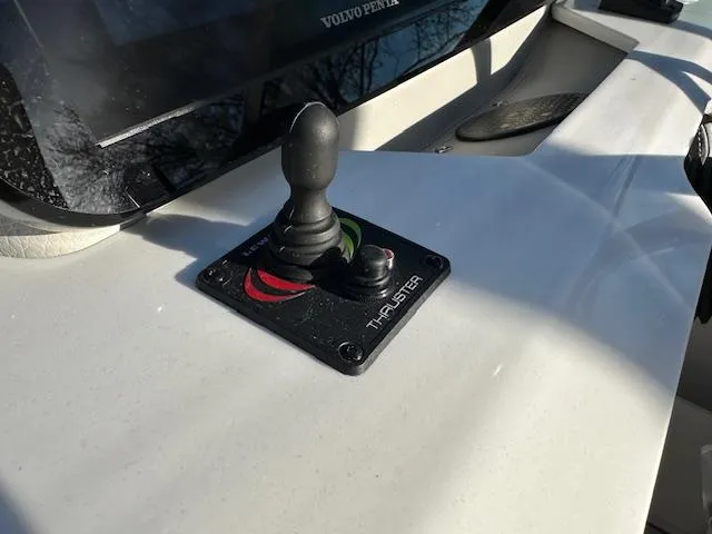Slide: The Image of 2025 Regal LS9 Surf boat thruster control panel with joystick. - 9