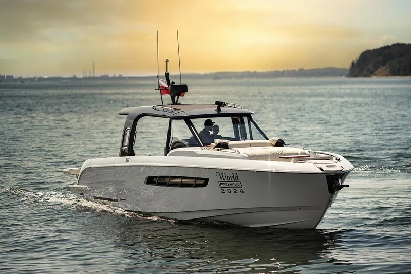 The Image of Wiszniewski Yachts W43, 2025 model, cruising on serene waters at sunset. - 1
