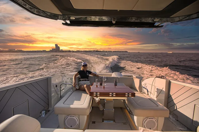 Slide: The Image of Luxurious 2025 Wiszniewski Yachts W43 cruising at sunset with a scenic ocean view. - 5