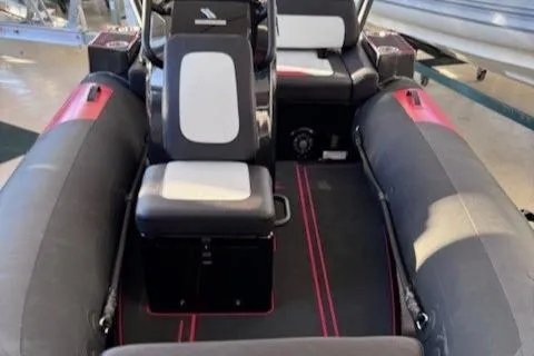 Slide: The Image of 2025 Highfield Jet 420 interior with black and white seating, red accents. - 3