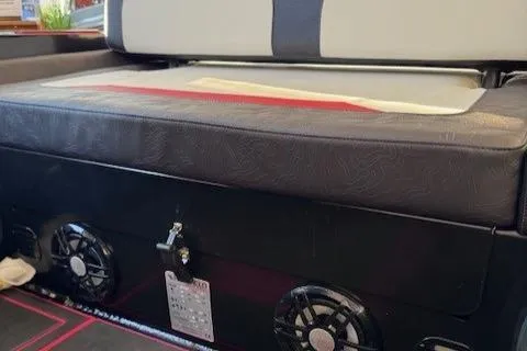 Slide: The Image of 2025 Highfield Jet 420 boat interior with cushioned seating and built-in speakers. - 5