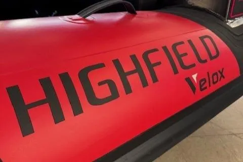 Slide: The Image of Red Highfield Jet 420 Velox boat, 2025 model, featuring bold branding. - 6