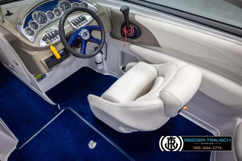 Slide: The Image of 2006 Crownline 230 LS boat interior with steering wheel and dashboard controls. - 23