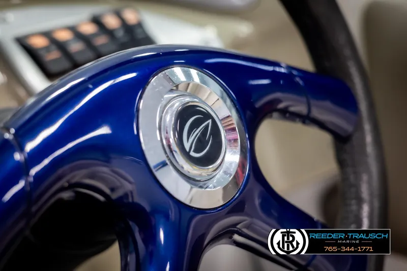 Slide: The Image of Close-up of 2006 Crownline 230 LS steering wheel with logo. - 26