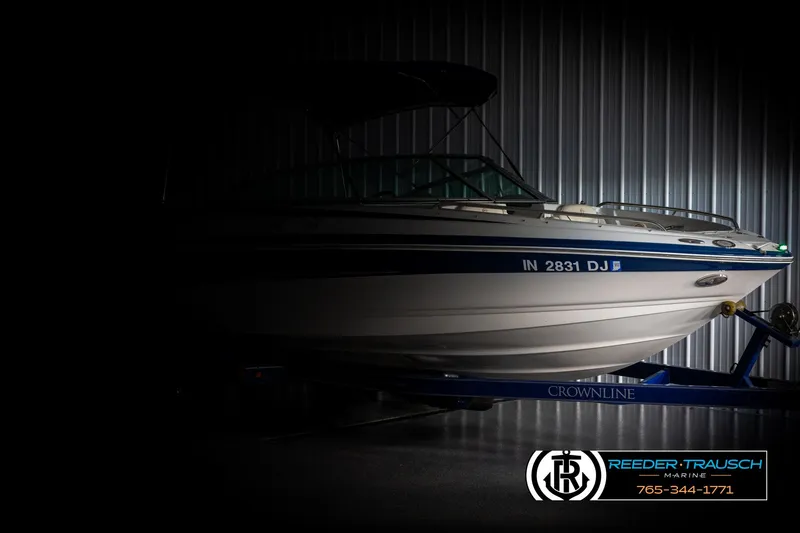 Slide: The Image of 2006 Crownline 230 LS boat in dimly lit storage, side view. - 4