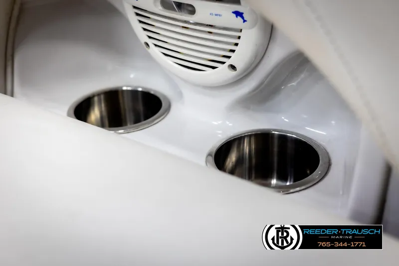 Slide: The Image of 2006 Crownline 230 LS boat interior with cup holders and speaker. - 41