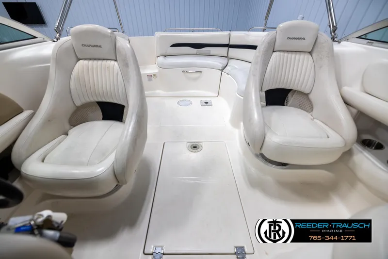Slide: The Image of Interior of 2002 Chaparral 243 Sunesta boat with white seating and clean design. - 17