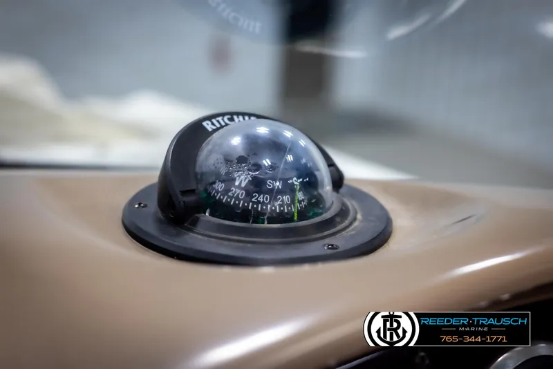 Slide: The Image of Compass on 2002 Chaparral 243 Sunesta boat dashboard, featuring Ritchie navigation. - 25
