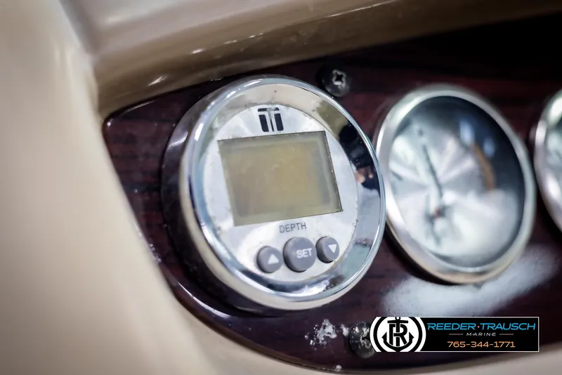 Slide: The Image of Close-up of 2002 Chaparral 243 Sunesta boat dashboard with depth gauge and dials. - 27