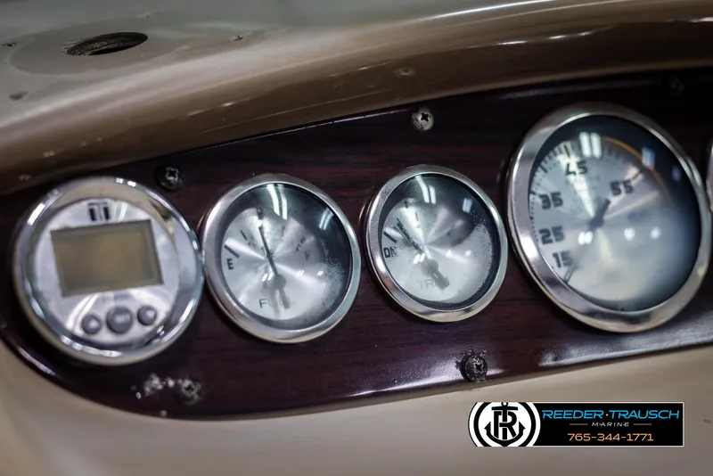 Slide: The Image of Dashboard of a 2002 Chaparral 243 Sunesta boat with gauges and controls. - 28