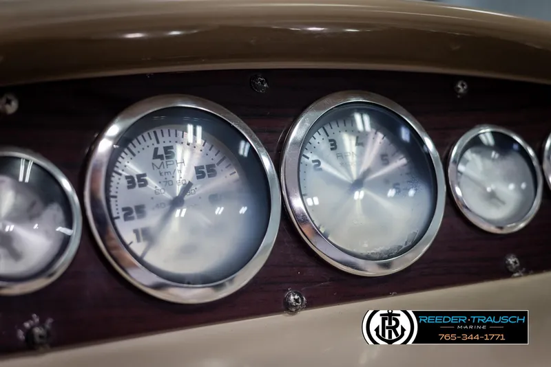 Slide: The Image of Dashboard gauges of a 2002 Chaparral 243 Sunesta boat, featuring speedometer and tachometer. - 29