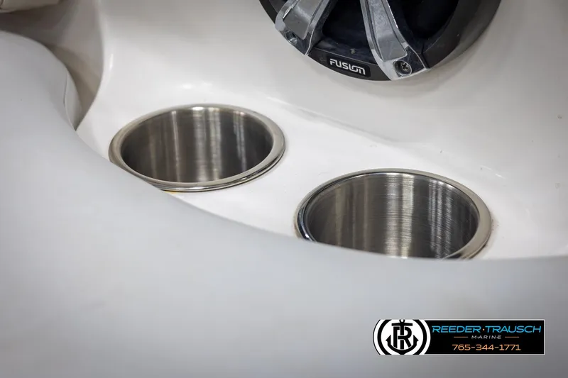 Slide: The Image of Cup holders and speaker on 2002 Chaparral 243 Sunesta boat interior. - 40