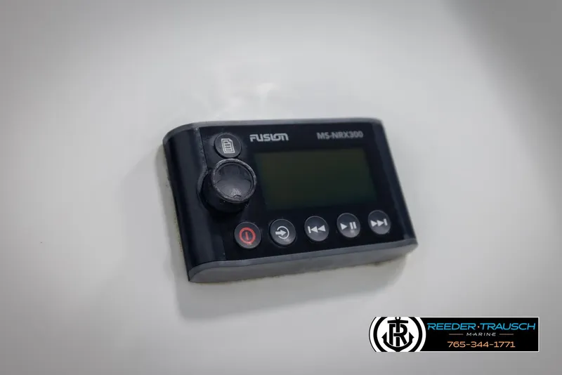 Slide: The Image of Fusion MS-NRX300 marine stereo controller on Chaparral 243 Sunesta, 2002 model. - 43