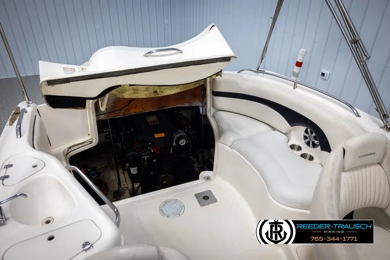 Slide: The Image of 2002 Chaparral 243 Sunesta boat interior with open engine compartment. - 46
