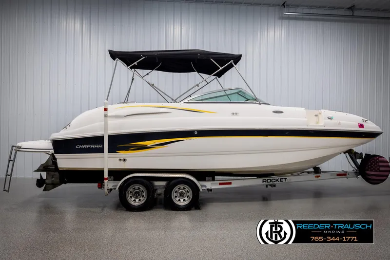 Slide: The Image of 2002 Chaparral 243 Sunesta boat on trailer in indoor showroom. - 5
