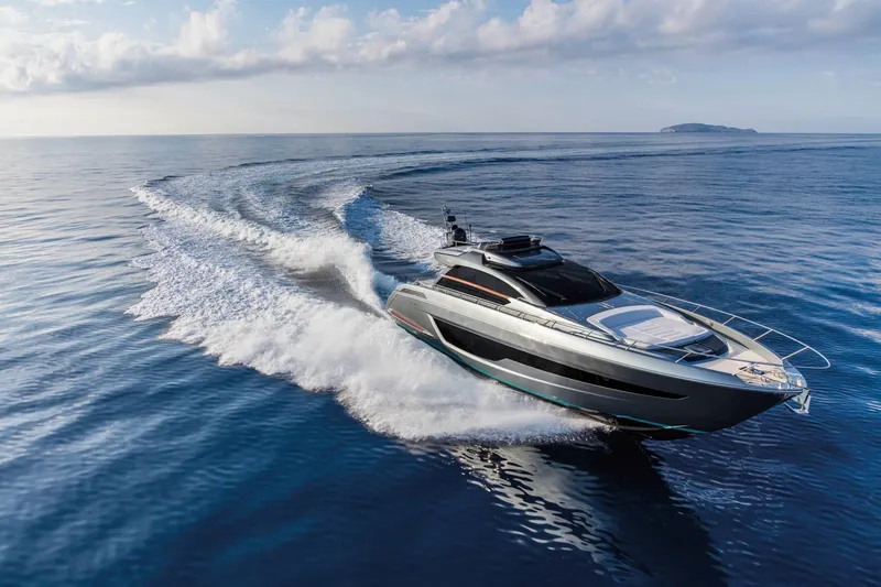 Slide: The Image of 2024 Riva 66' Ribelle luxury yacht cruising on open sea. - 3