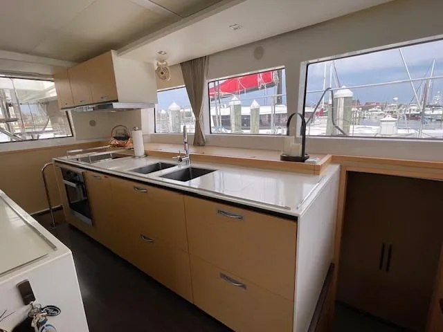 Slide: The Image of Modern kitchen on a 2014 Lagoon 620 yacht. - 12