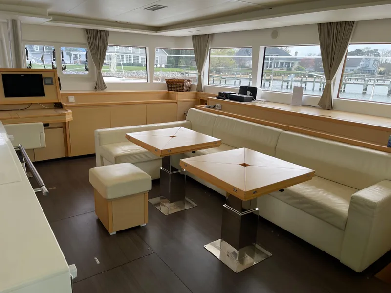 Slide: The Image of Interior of a 2014 Lagoon 620 yacht with modern furnishings. - 15
