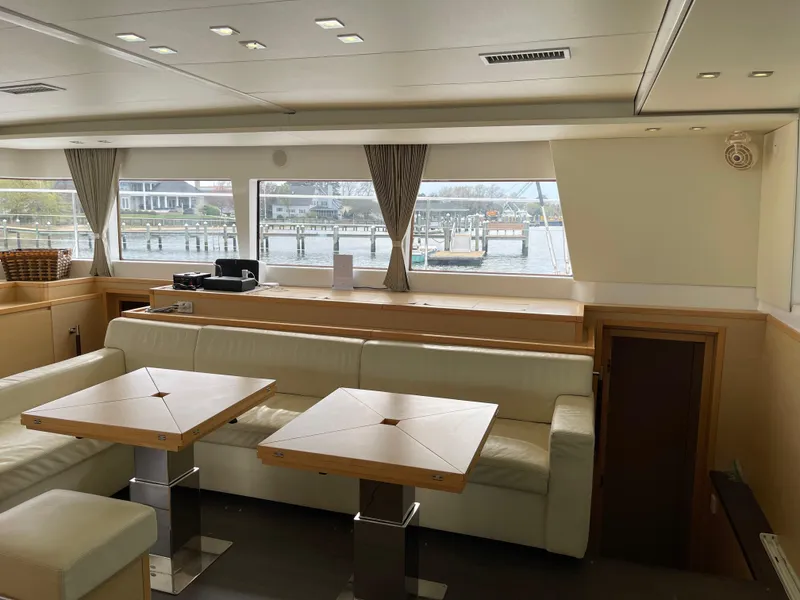 Slide: The Image of Interior of a 2014 Lagoon 620 yacht with harbor view. - 16