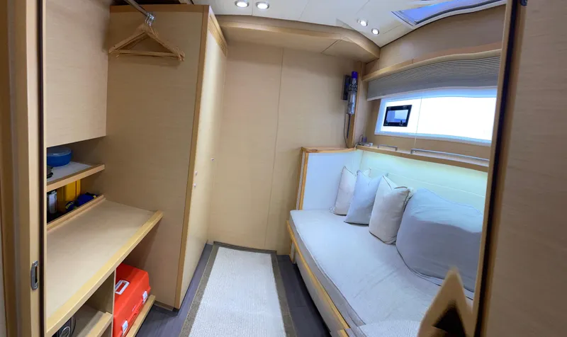 Slide: The Image of Interior of a 2014 Lagoon 620 yacht with cozy sofa and storage space. - 2