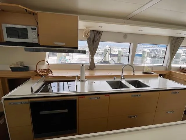 Slide: The Image of Interior of Lagoon 620 yacht kitchen, 2014 model. - 24