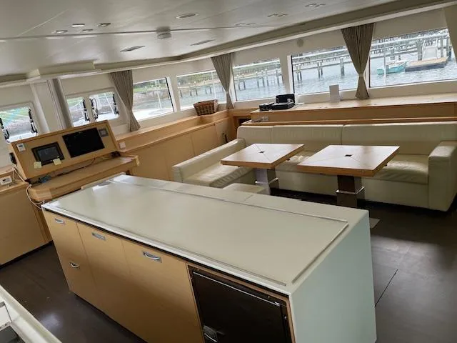 Slide: The Image of Interior of a 2014 Lagoon 620 yacht with modern furnishings. - 25