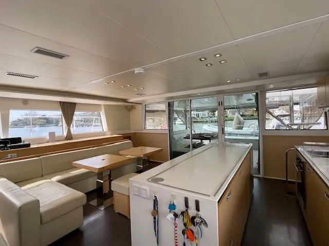 Slide: The Image of Interior of a 2014 Lagoon 620 yacht with modern furnishings. - 30