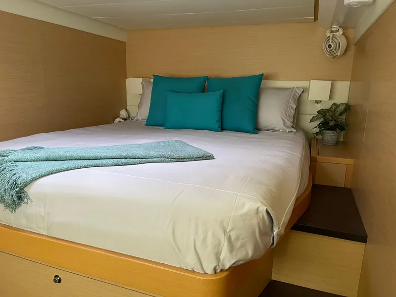 Slide: The Image of Luxurious bedroom in 2014 Lagoon 620 yacht with teal accents. - 40