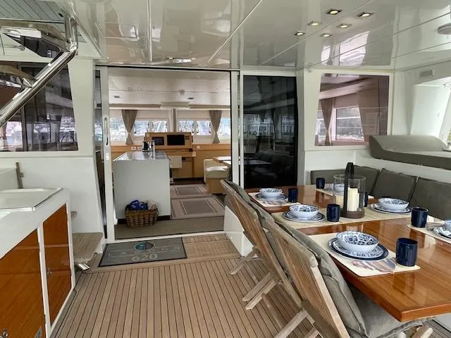 Slide: The Image of Interior of a 2014 Lagoon 620 yacht with set dining table. - 46