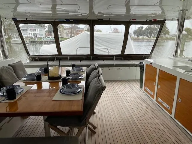 Slide: The Image of Interior of Lagoon 620 yacht, dining area with set table. - 49