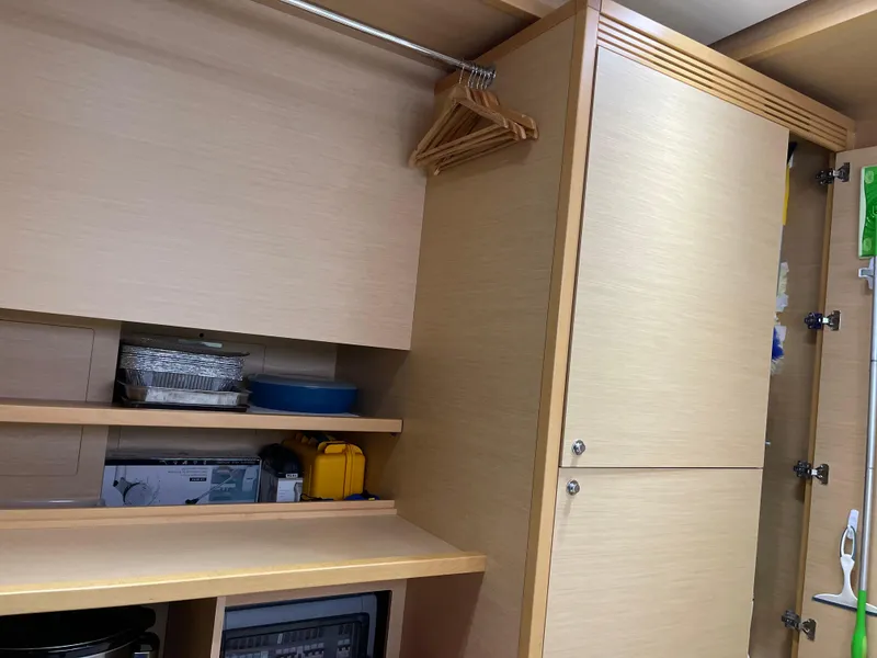 Slide: The Image of Interior of Lagoon 620 yacht, cabinets and shelves, year 2014. - 6