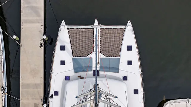 Slide: The Image of Lagoon 620 catamaran docked at sunset, 2014 model, named Phoenicia. - 64